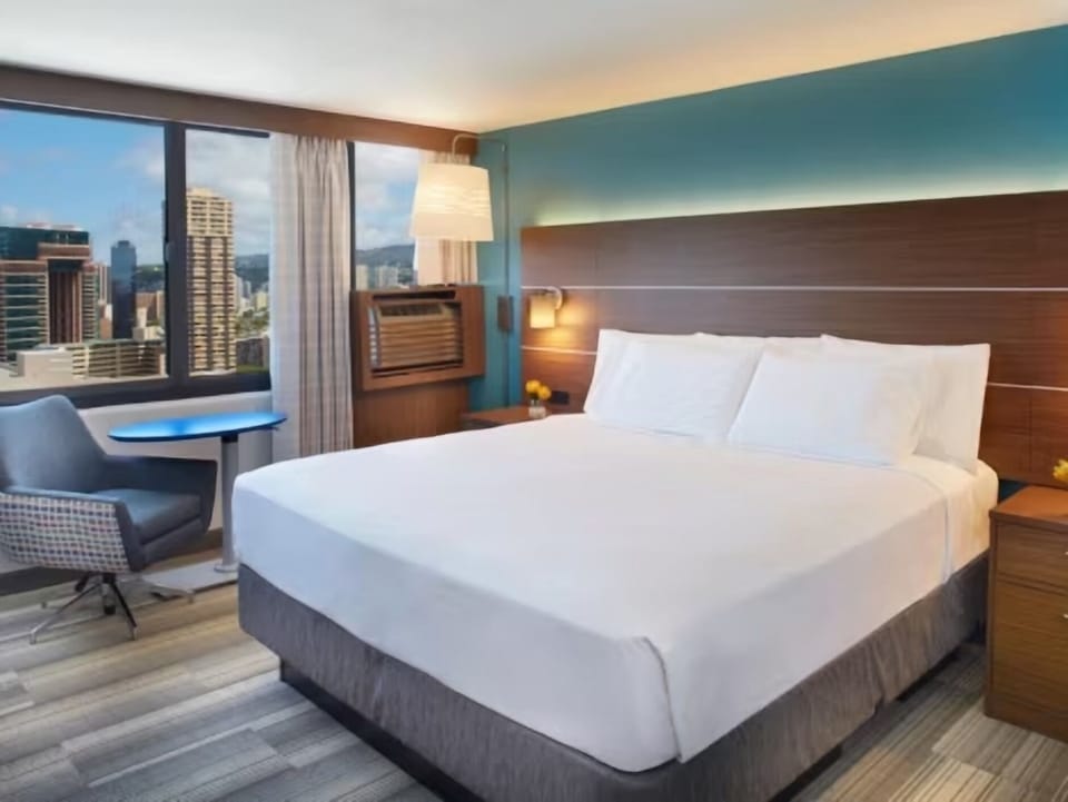 Unwind by the window with skyline views and soft lighting.