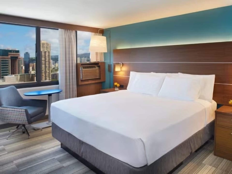 Unwind by the window with skyline views and soft lighting.