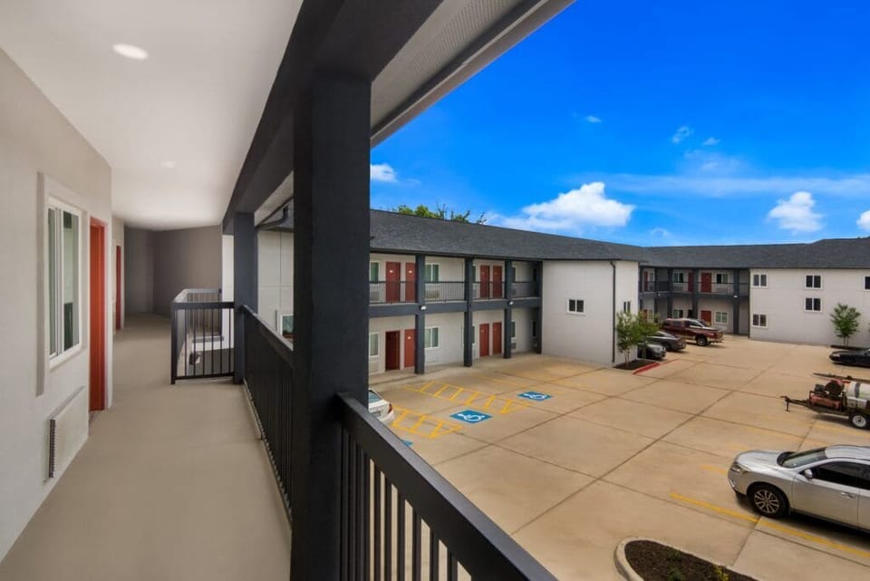 Step outside to breezy exterior corridors with easy room access.