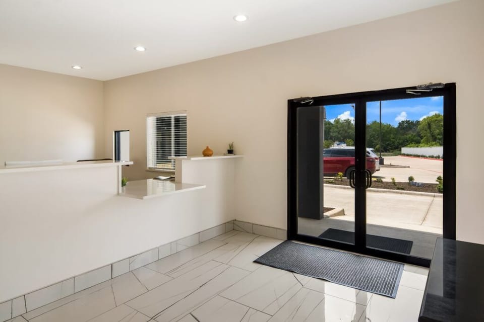 Check in smoothly in a clean, bright lobby entrance area.
