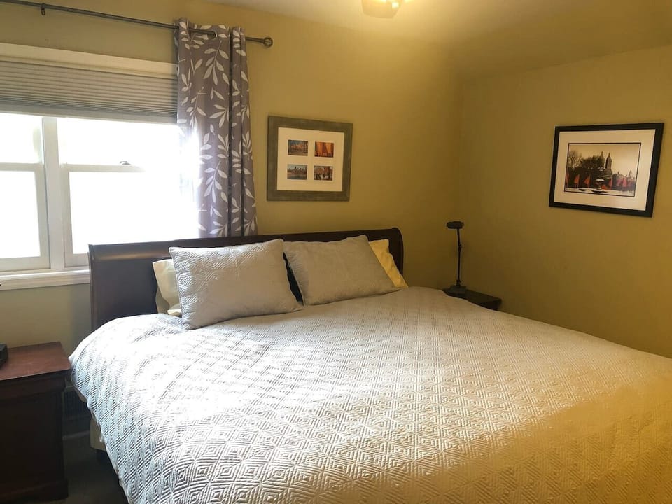 Warm and cozy bedroom with a king bed and tasteful decor.