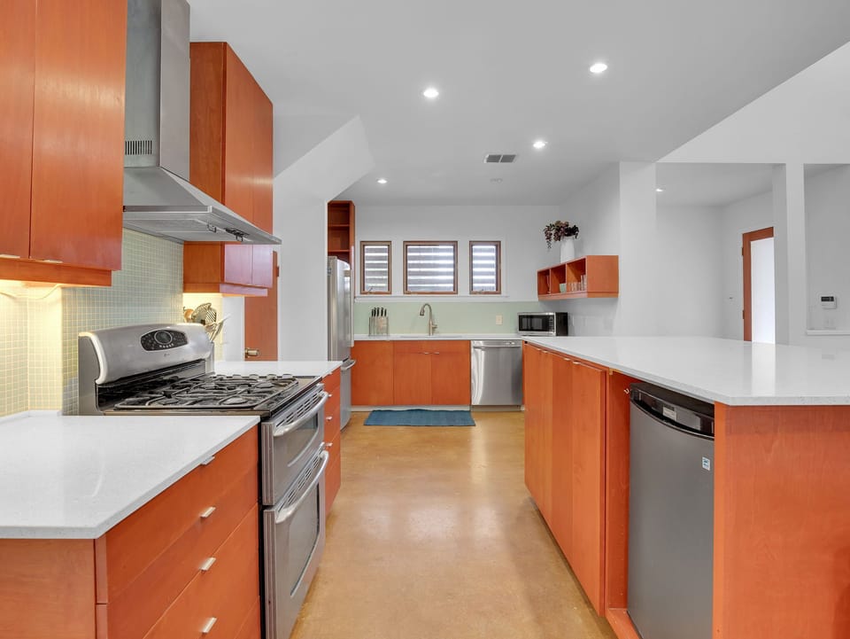 Gas stove and view of kitchen island; plenty of room to entertain.