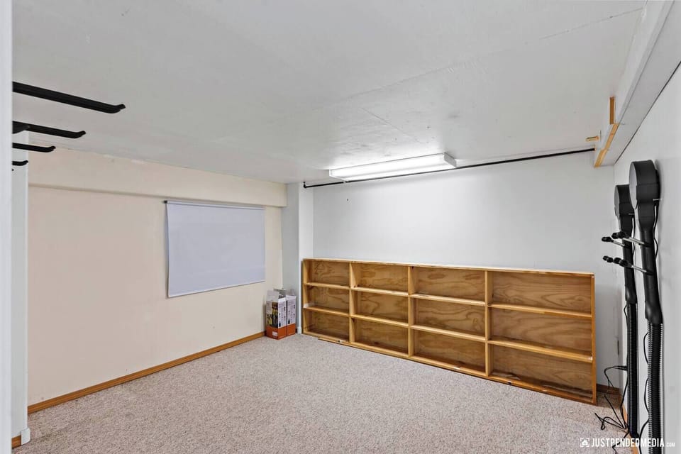 heated storage under house - gear room with ski hooks & boot dryers
