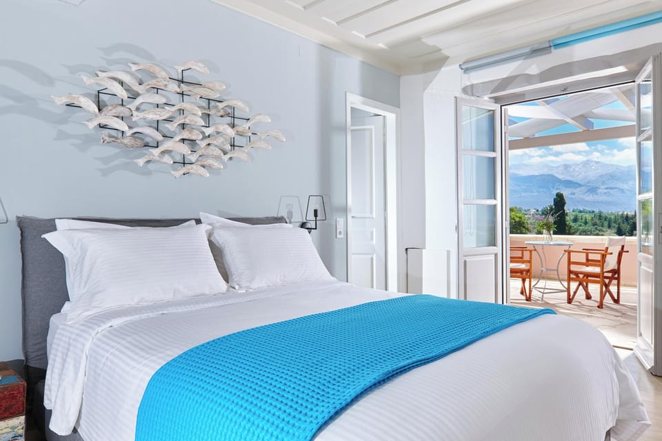 This bedroom also features an ensuite bathroom with a walk-in shower and an open-style closet with a safe deposit box