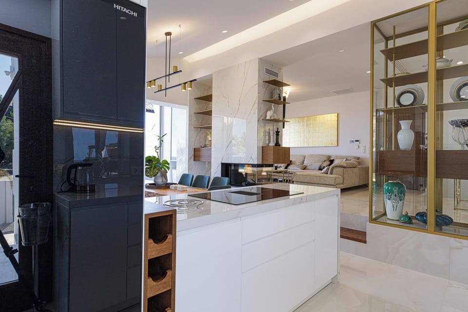 A lavish indoor area adorned with white and gold marble