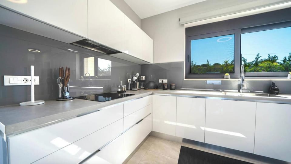 Fully equipped kitchen featuring all modern appliances