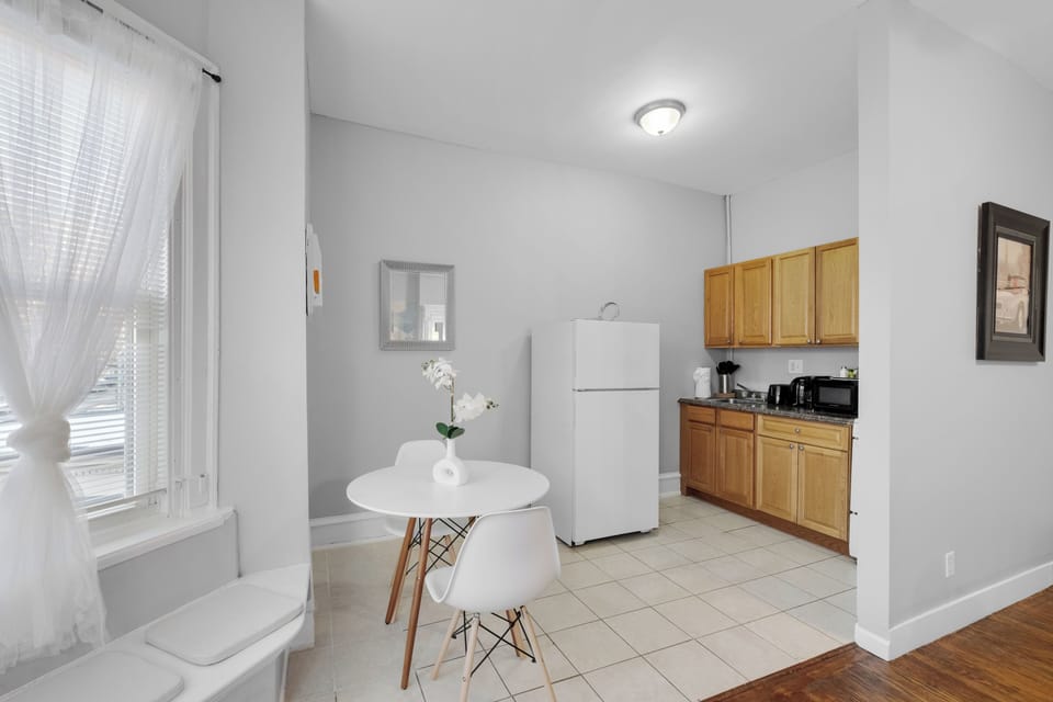 Dining table with two modern white chairs