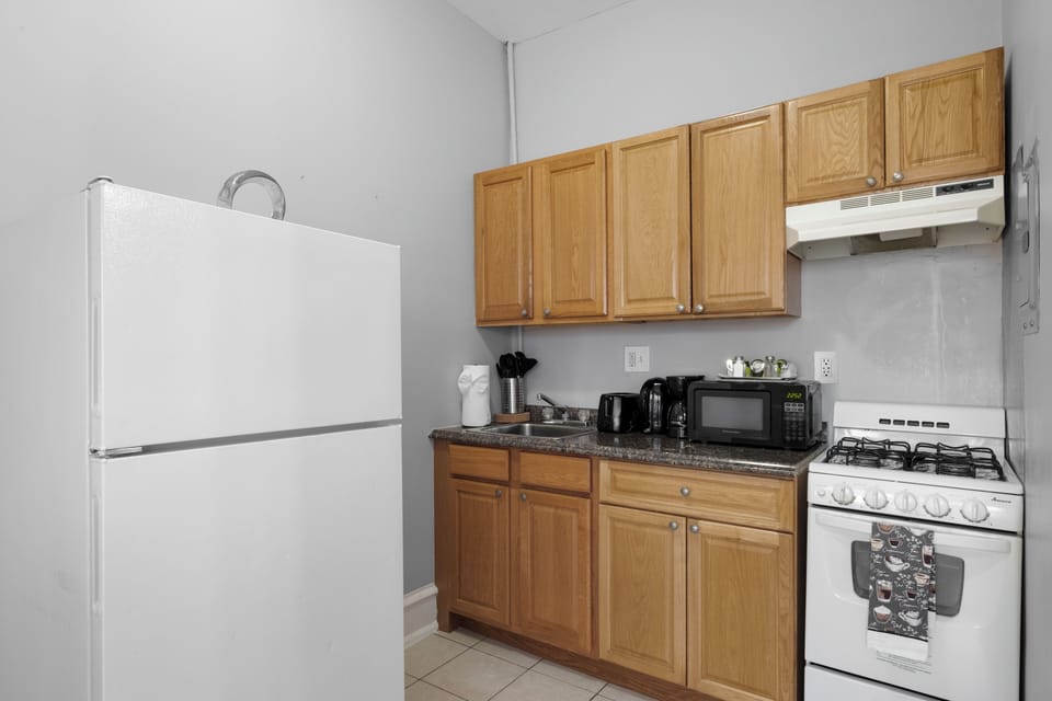 Full-size refrigerator in kitchen area