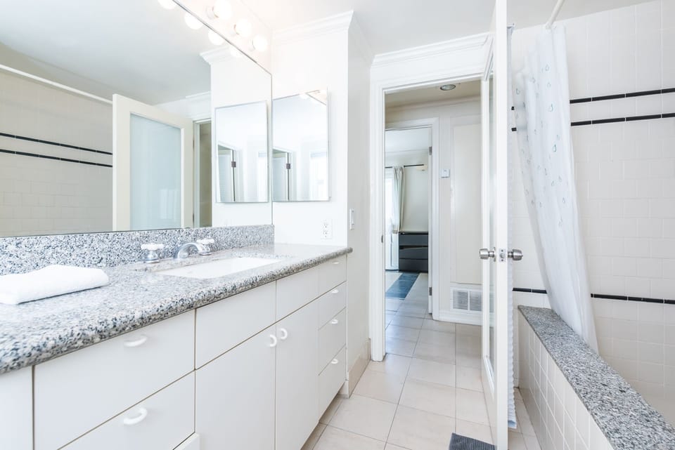 Freshen up in the hallway bathroom with a spacious vanity.
                