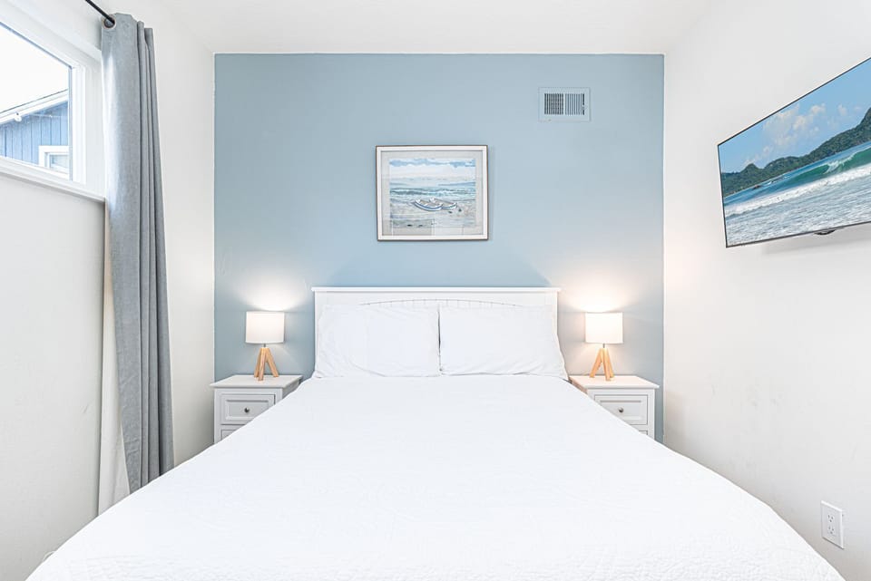 This inviting guest bedroom is designed for elevated comfort and rest with a full-size bed
                