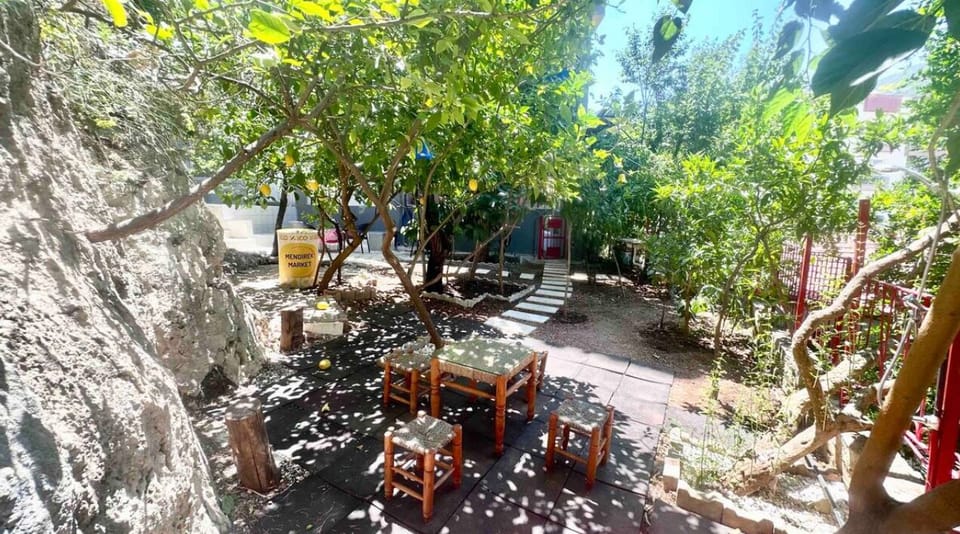 This garden, surrounded by greenery, is perfect for relaxing outdoors.