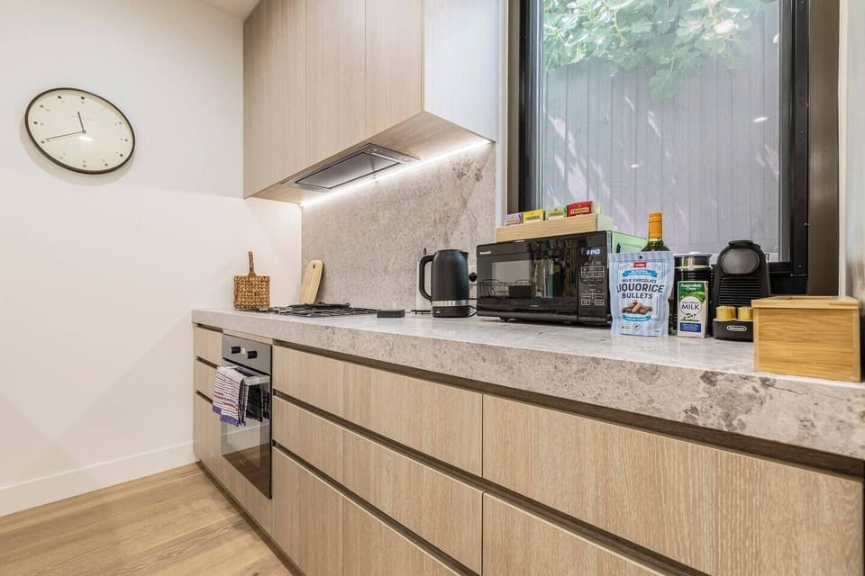 With all cooking basics, high-quality appliances such as oven and stove, and direct access to natural light, this kitchen becomes the heart of the home, perfect for creating your favourite comfort meals after a day out.