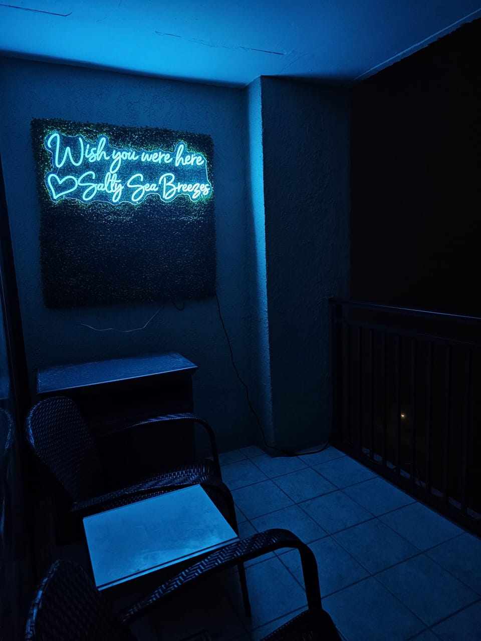Instagram wall lit up at night while you have your favorite cocktail!