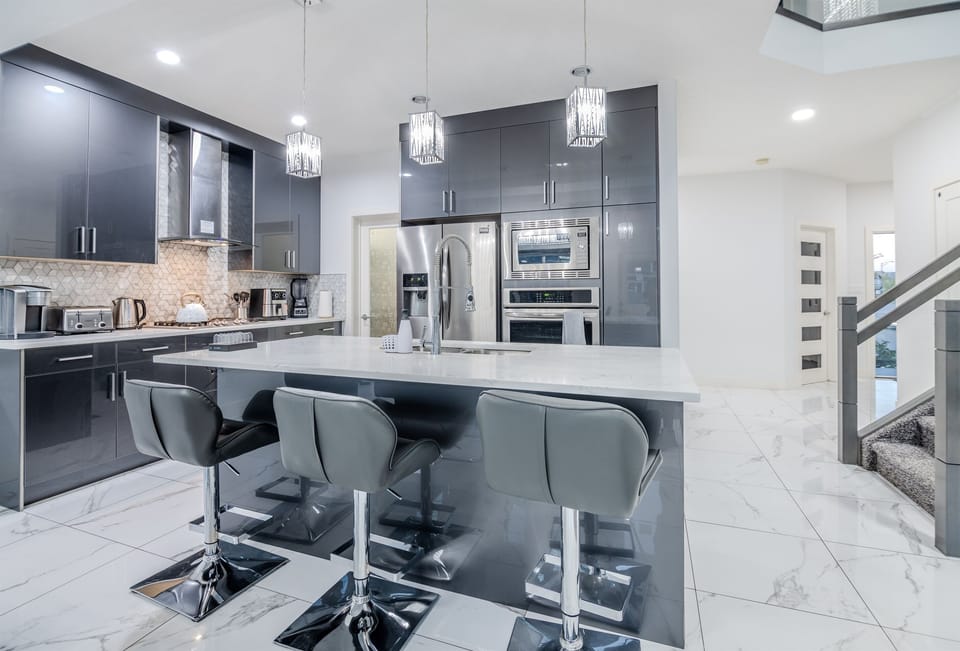 Fully equipped luxury kitchen with premium appliances and ample space for cooking and dining