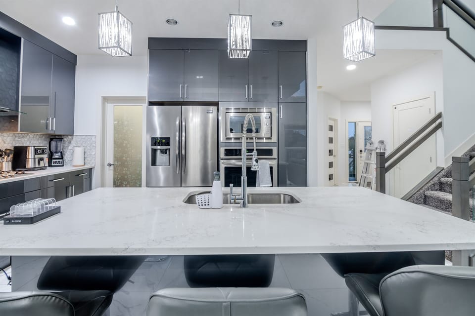 Fully equipped luxury kitchen with premium appliances and ample space for cooking and dining