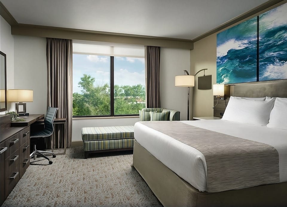Settle into a bright room with views, workspace, and comfort.