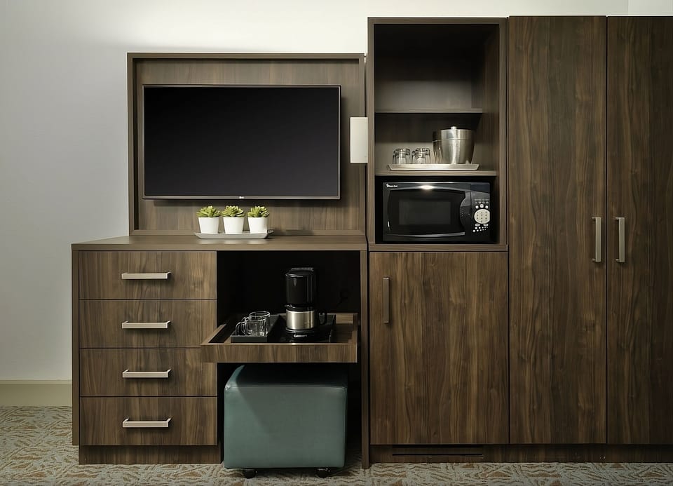 Brew morning coffee and stash snacks with in-room essentials.