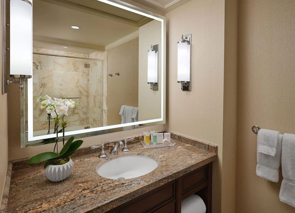 Enjoy a spa-like rinse with bright mirror lighting.