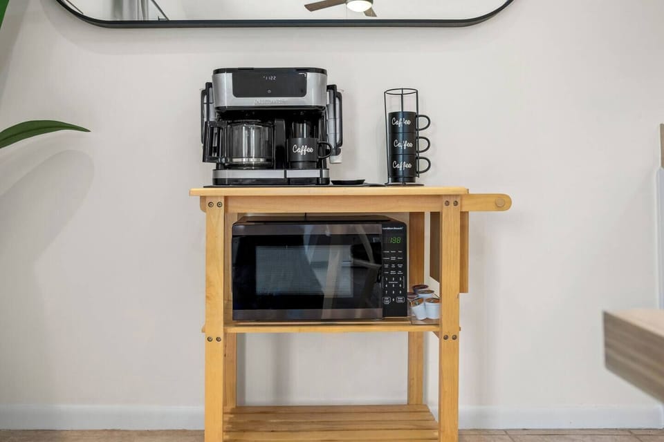 Wake up to the morning sunshine and stroll over to your coffee bar which is fully stocked with provided K-cups, creamer or tea. This dual-brew coffee maker provides a full pot to share or pop in a single K-cup for that perfect solo moment. Enjoy!  