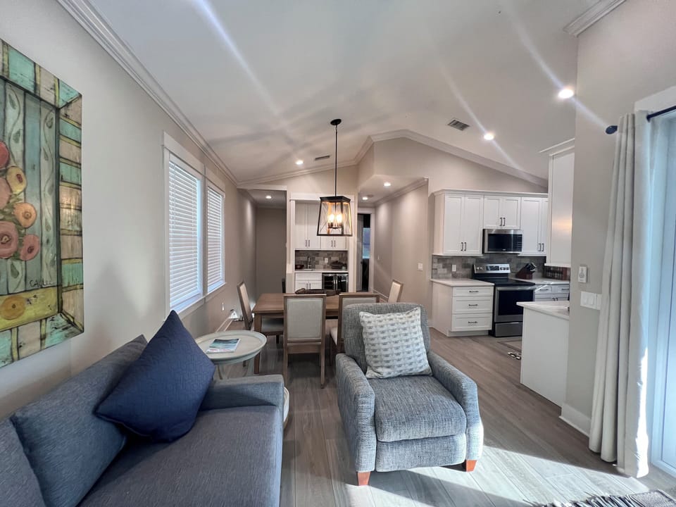 Looking back toward kitchen, powder room, master suite, wet bar and stairs