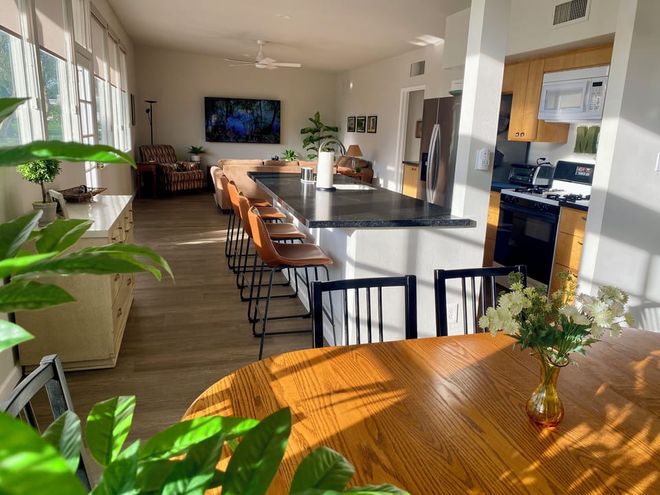 View of the living room, kitchen, and Island from the dining room.