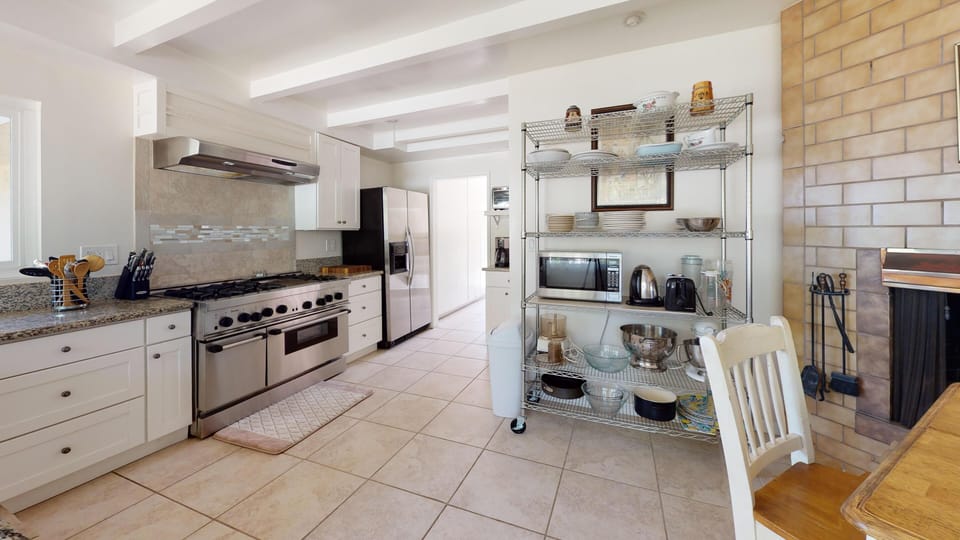 Open shelving and plenty of cabinets offers plenty of storage space