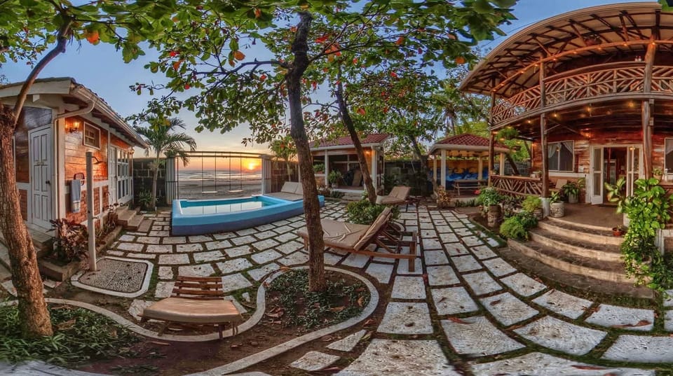 Golden Hour at the Beach House.   Come experience our magical sunsets and evening atmosphere.   Watch the sun wet from our His & Her swings overlooking the entire beach and ocean. <3