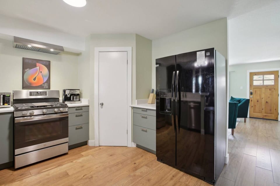 Another view of the kitchen and hallway to living room