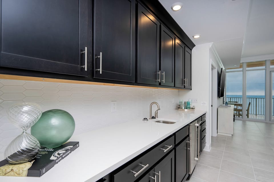 Grab a chilled drink from the fridge or create your favorite cocktail at the wet bar
