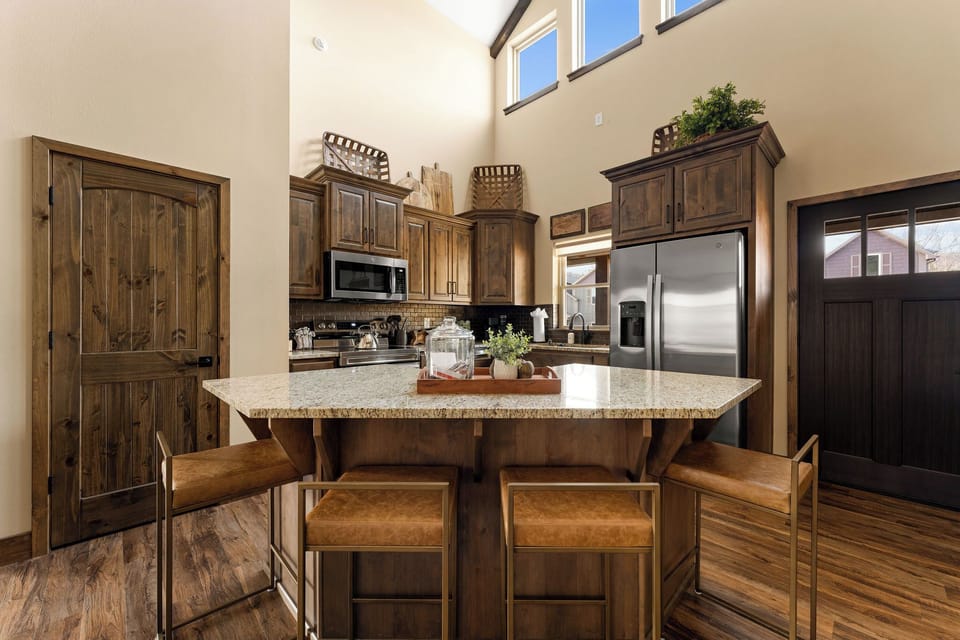 Kitchen island seats four.  Your family and guests have a great spot to join in on all the food prep, just like at home. 