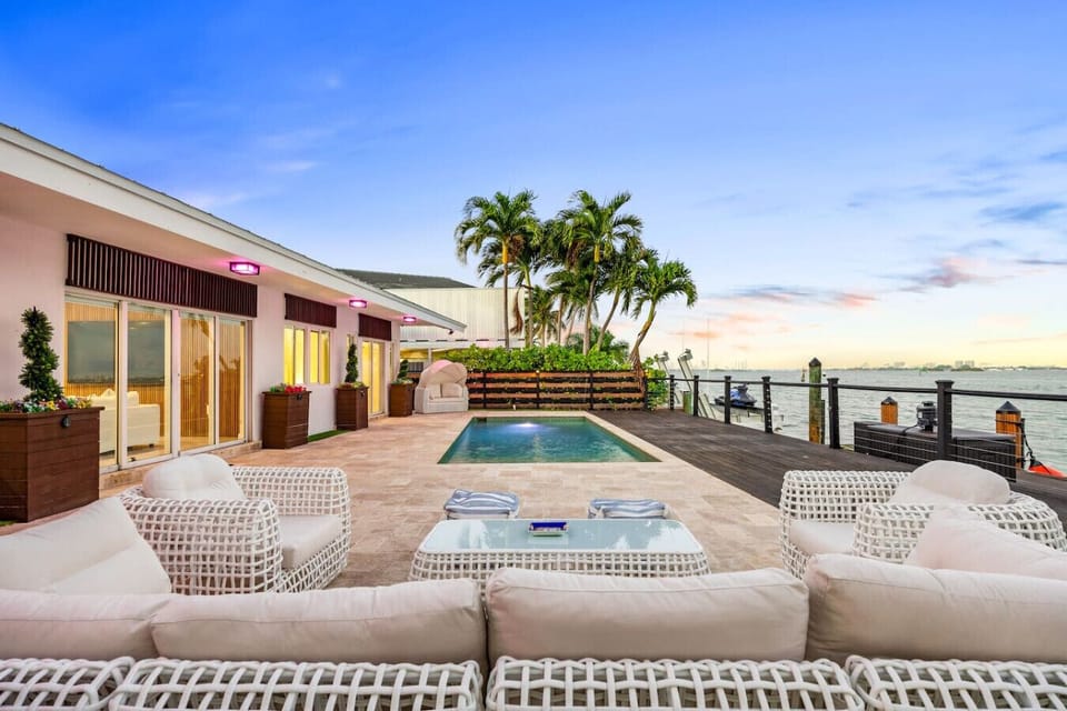 Elegant outdoor oasis with pristine swimming pool and stunning harbor views at golden hour
