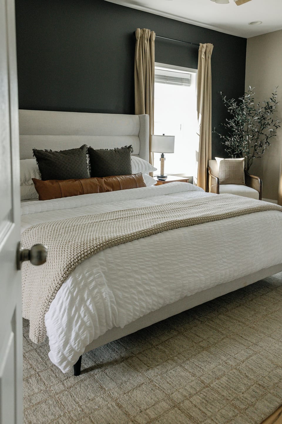 Rest in a serene king suite with an ensuite bath and cozy design. 