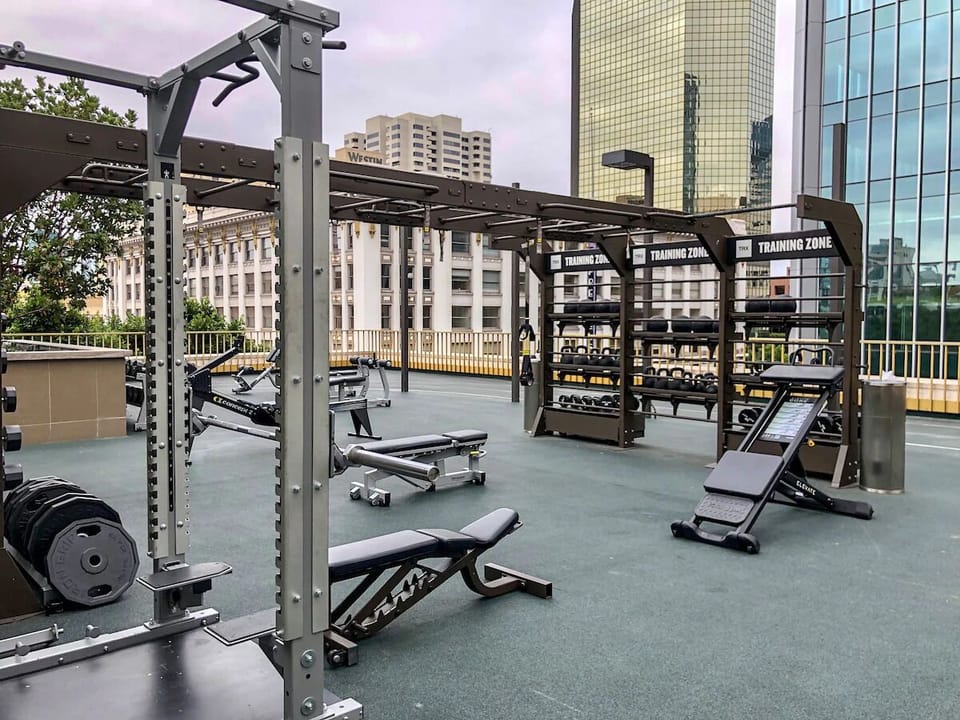 Keep your routine strong with rooftop workouts and city views.