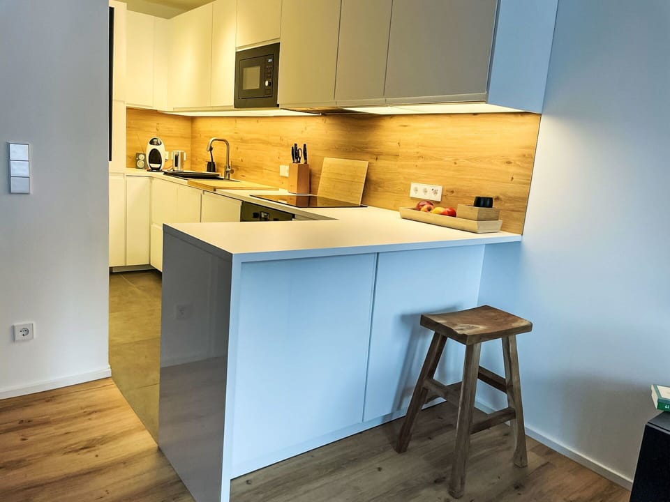 Countertop, Kitchen, Furniture, Interior Design, Flooring, Cabinetry, Kitchen Appliance, Floor, Wood, Major Appliance