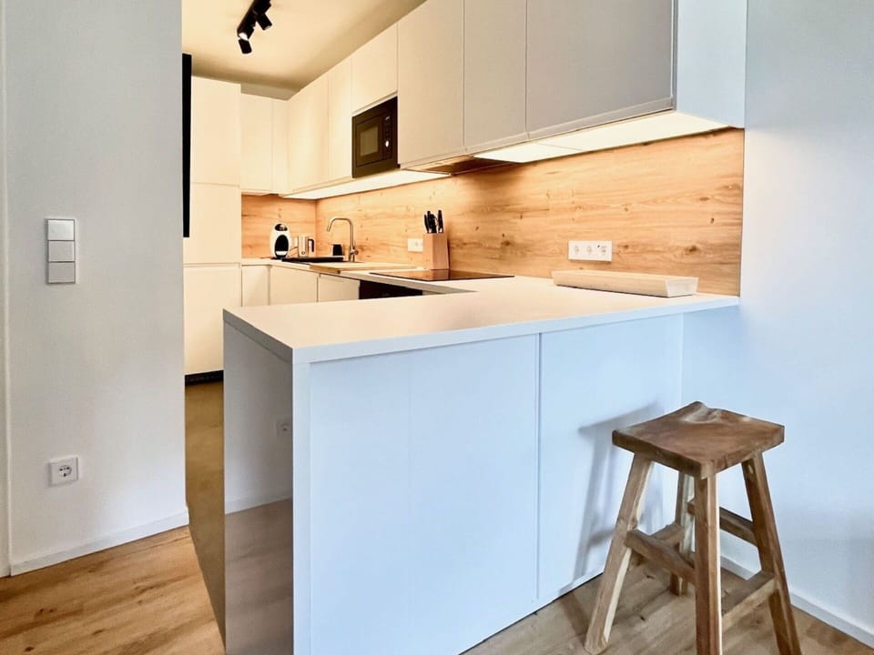 Countertop, Furniture, Interior Design, Kitchen, Flooring, Cabinetry, Floor, Wall, Wood, Kitchen Appliance