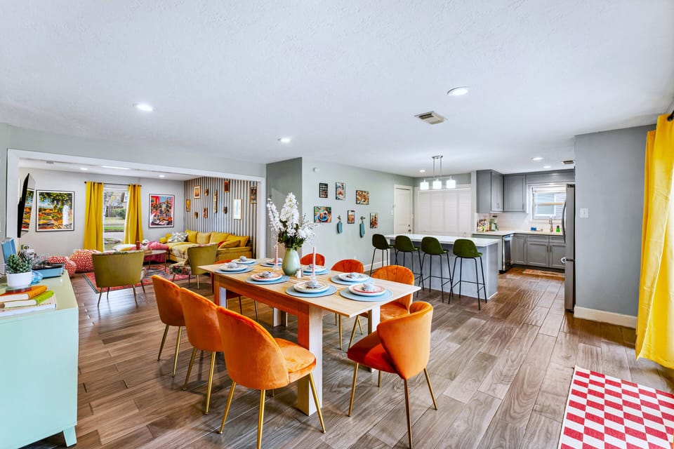 Open floor plan concept featuring dining area, living room and full kitchen