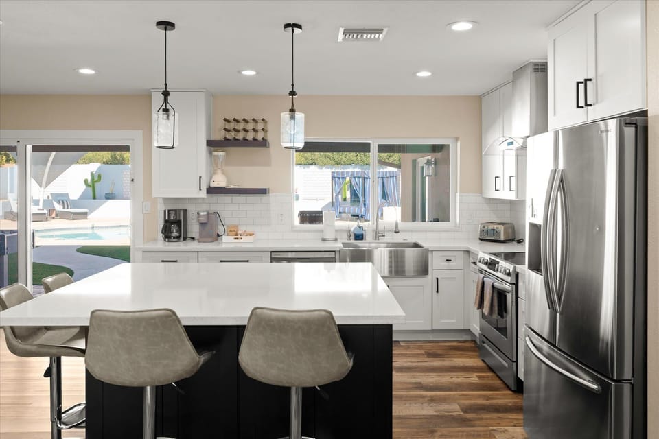 Gather around the spacious island with high seating—perfect for meals, conversations, and entertaining.