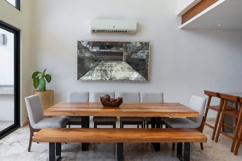 Luxurious and modern dining room. It has AC and views of the patio.