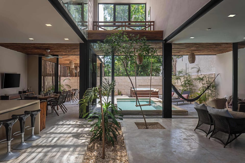 Ground floor of the property. It features a living room, dining room, kitchen, and access to the backyard