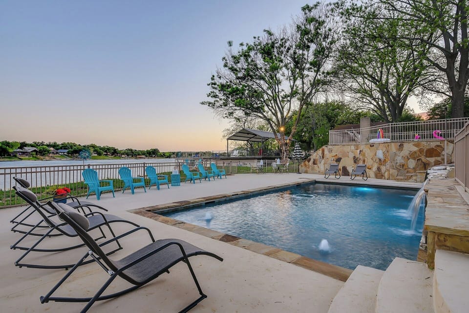 Large lower pool with slide and waterfall