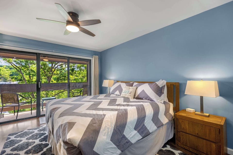 The primary king suite boasts a private ensuite, smart TV, & balcony access