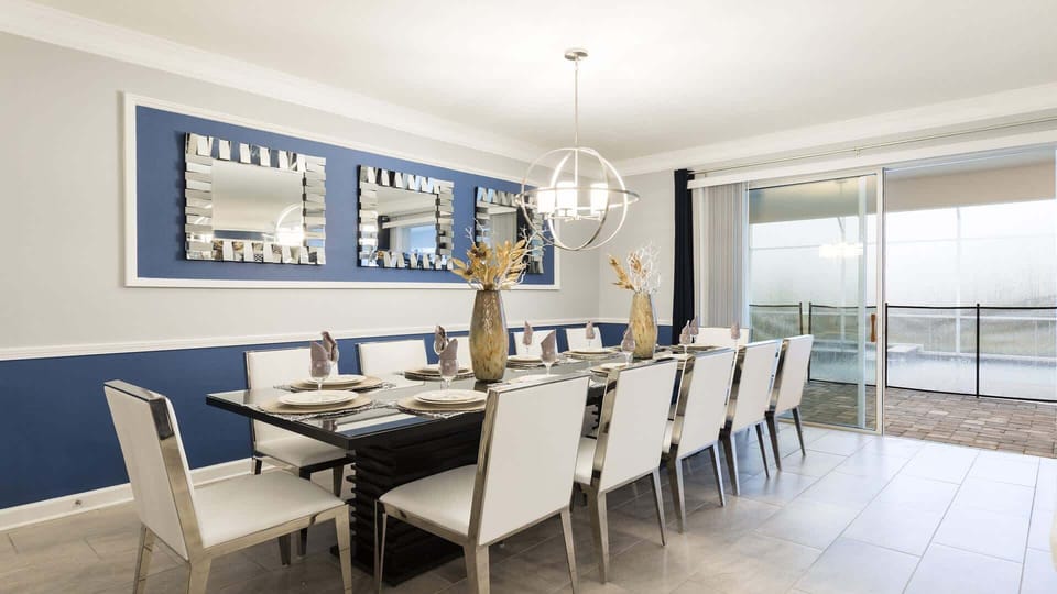 Elegant dining room with seating for 12, modern decor, and natural light views.