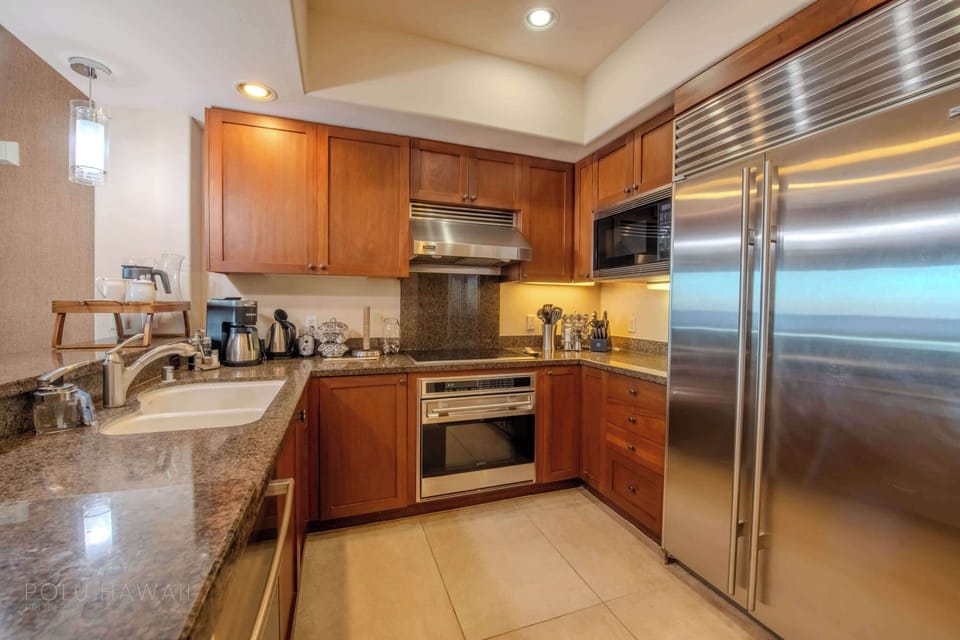 Kitchen with upgraded Wolfe and Subzero appliances. Includes dishwasher detergent, air fryer, coffee maker, bag of 100% Kona coffee, kettle, toaster. blender, mixing bowls, utensils, and stainless steel pots & pans.