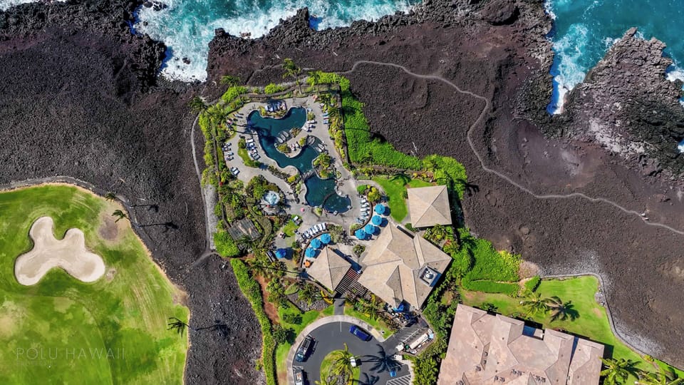 Birds eye view of the Hali’i Kai Ocean Club with lagoon pool, restaurant, bar, and hot tub.