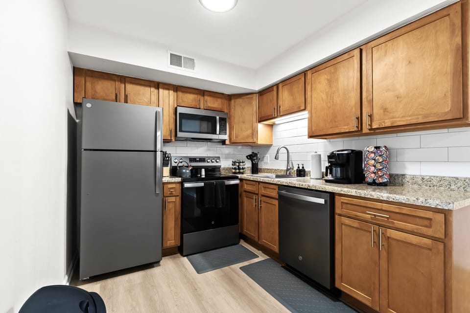 This modern kitchen comes fully stocked with a knife set, spice rack, and all the essential cooking tools.
