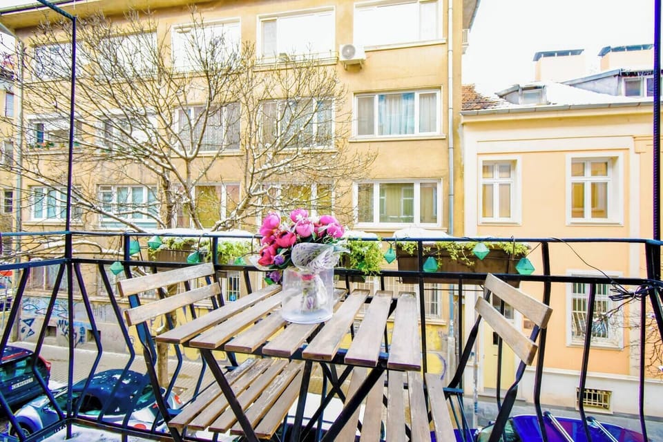 Soak in the vibrant atmosphere of Sofia from the private balcony, complete with outdoor seating and charming views of the surrounding neighborhood.