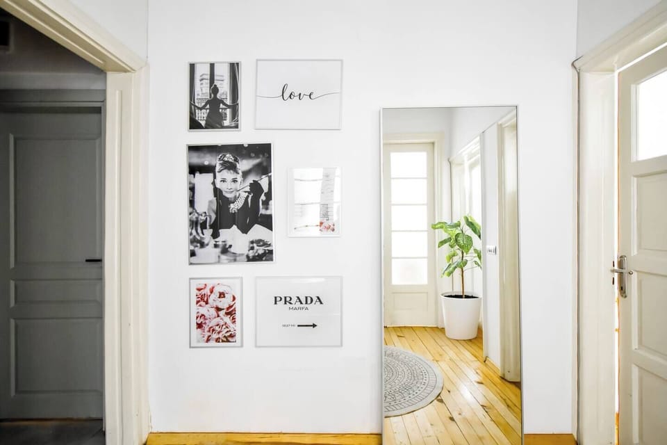 Make a stylish entrance into this well-decorated hallway, featuring artistic touches that set the tone for your stay.