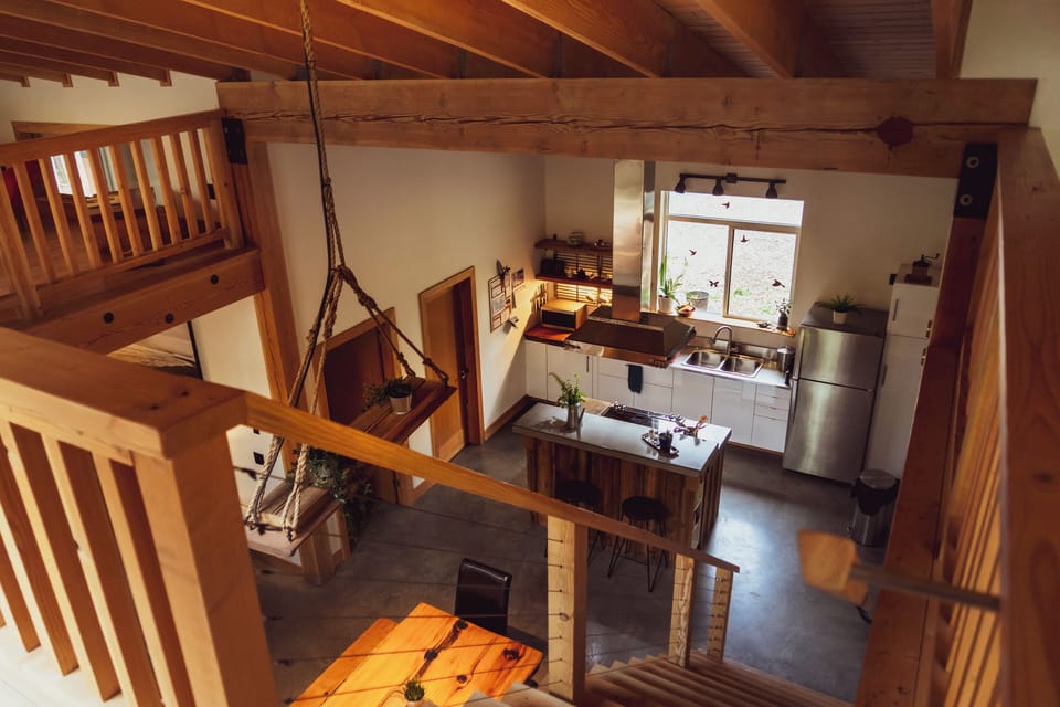 Open concept kitchen, dining, living, and loft space.