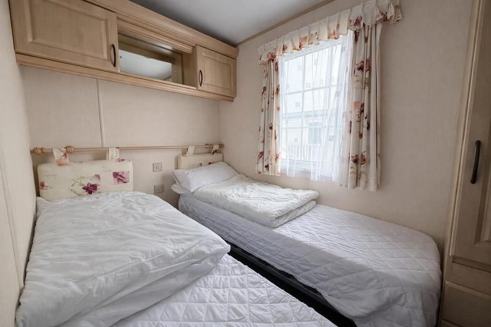 This twin bedroom provides a peaceful haven for rest after a fun-filled day on the East Yorkshire coast.
