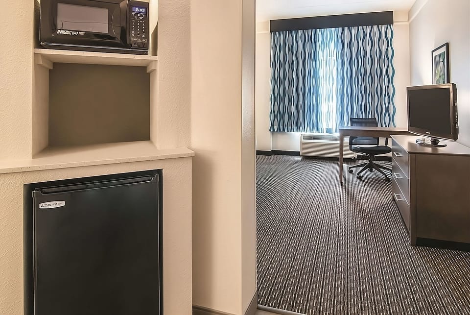 Stock snacks and reheat favorites with convenient in-room kitchenette.